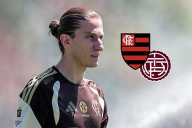 Filipe Luís durante treino do Flamengo ao lado dos escudos de Flamengo e Lanús
