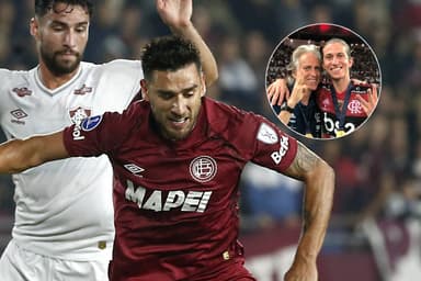 Eduardo Salvio durante Lanús x Flamengo, ao lado de uma foto de Filipe Luís e Jorge Jesus