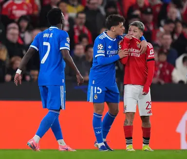 Gianluca Prestianni of Benfica speaks towards Vinicius Junior of Real Madrid during the UEFA Champions League 2025/26 League Knockout Play-off First Leg match between SL Benfica and Real Madrid C.F. at Estadio do SL Benfica on February 17, 2026 in Lisbon,